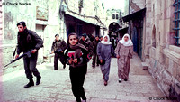 Palestinian women surrounded by Israeli soldiers, Jerusalem, IL