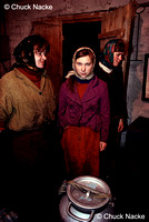 Girl and women collecting milk at a dairy near Chernobyl, UA