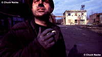 Russian Coal Miner smokes in the morning sun after his shift in the mine, Shakhty, RU